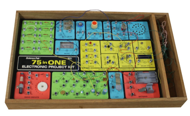 A typical spring-clip electronics kit; note the sprawling mess of wiring.